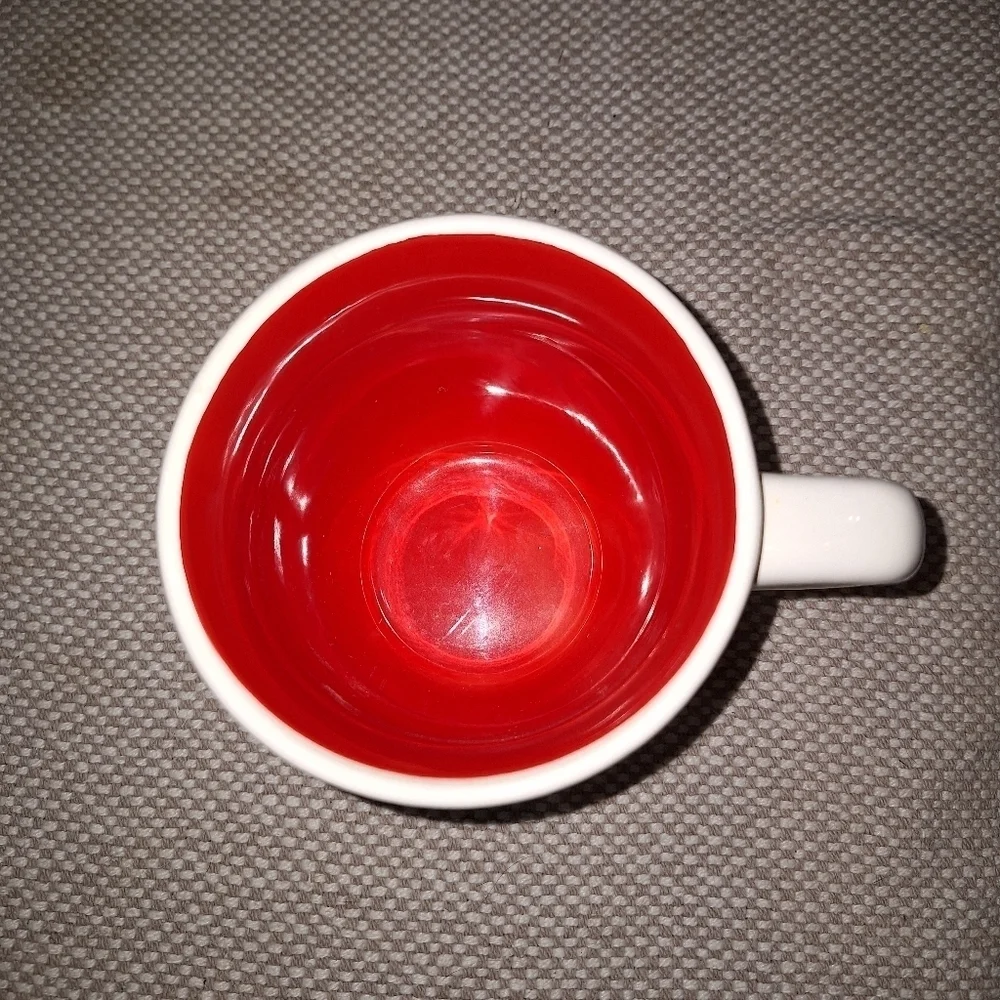 A Rae Dunn Mrs Claus coffee cup. It's pre-loved in great condition.
